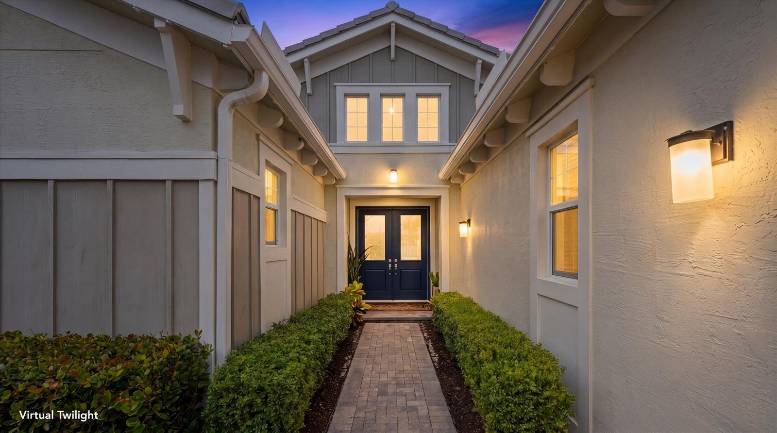 A paved walkway leads to a dark blue double front door between two exterior walls — 5919 Jasmine Lane, Westlake FL 33470, WESTLAKE, FL