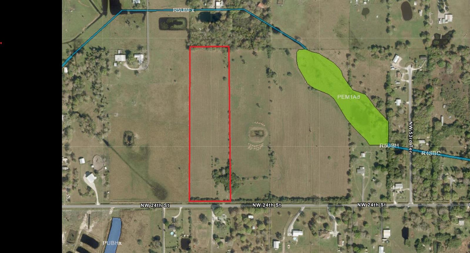 This aerial map shows a rectangular parcel of land outlined in red along a road — 5871 NW 24th Street, Okeechobee FL 34972, OKEECHOBEE, FL