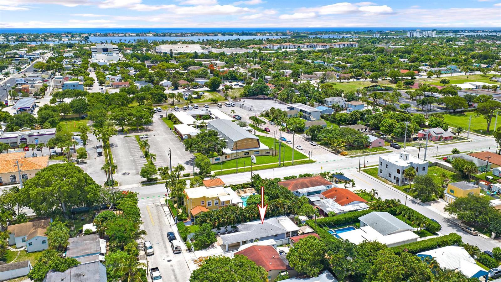 An aerial view shows a residential neighborhood with a red arrow pointing to a house — 904 Ortega Road, West Palm Beach FL 33405, WEST PALM BEACH, FL