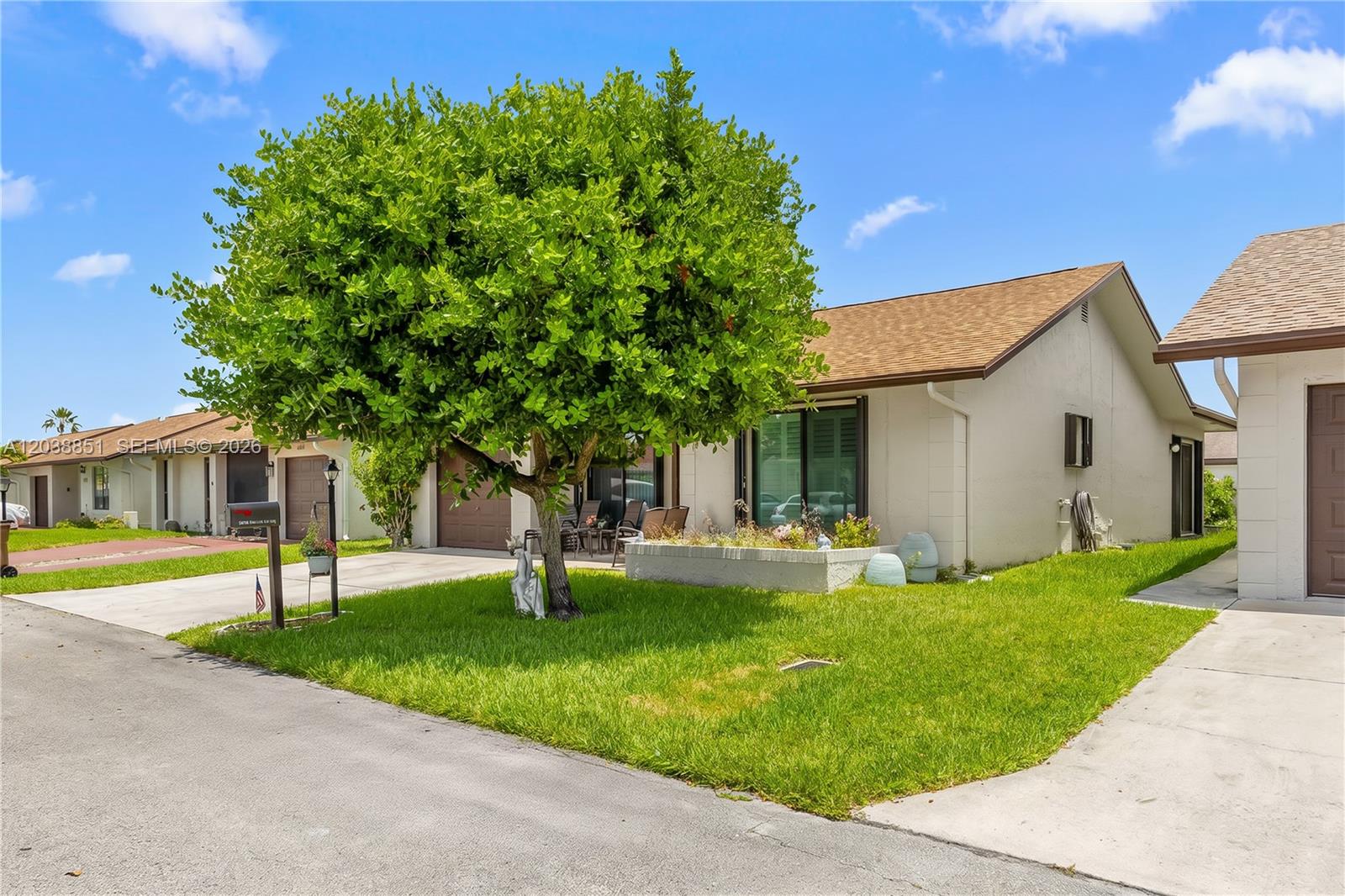 A single-story house with a large tree in the front yard and a concrete driveway — 2065 SW 17th Dr, Deerfield Beach FL 33442, DEERFIELD BEACH, FL