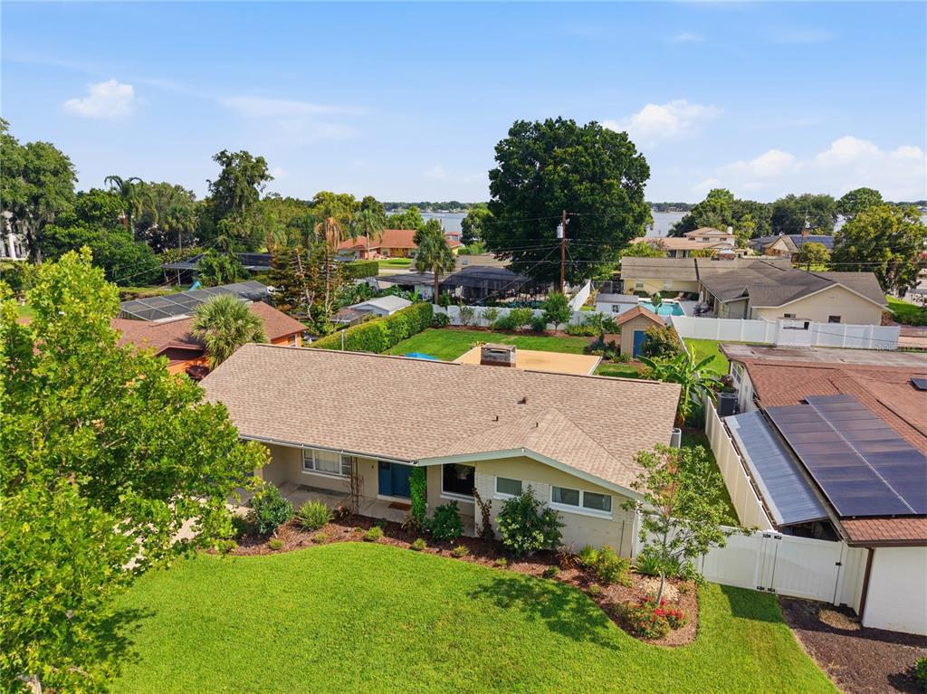 An aerial view of a single-story house with a shingled roof and a front lawn — 2817 FLOWERTREE ROAD, ORLANDO, FL