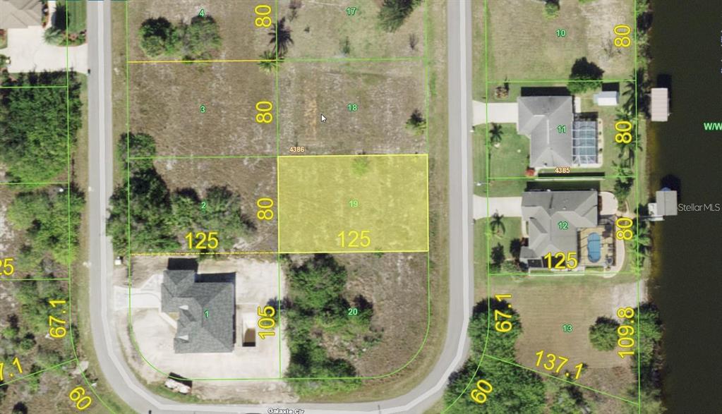 This is an aerial map showing a highlighted vacant residential lot in a suburban neighborhood — 9541 GALAXIE CIRCLE, PORT CHARLOTTE, FL