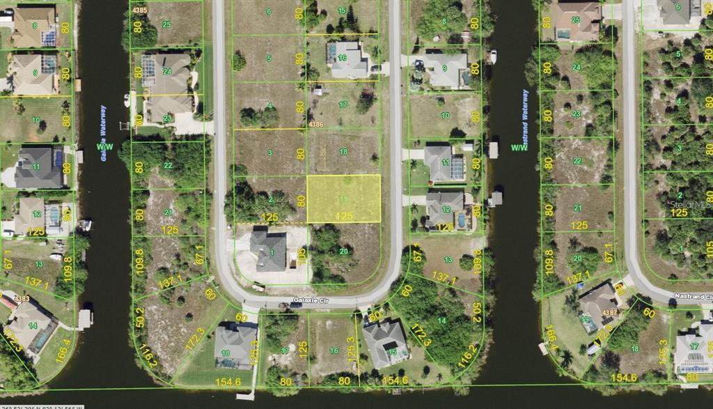 This is an aerial map showing residential lots and waterways in a suburban neighborhood — 9541 GALAXIE CIRCLE, PORT CHARLOTTE, FL