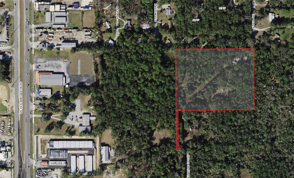 This aerial map shows a rectangular parcel of land outlined in red near a highway — 1746 S PALM AVENUE, HOMOSASSA, FL