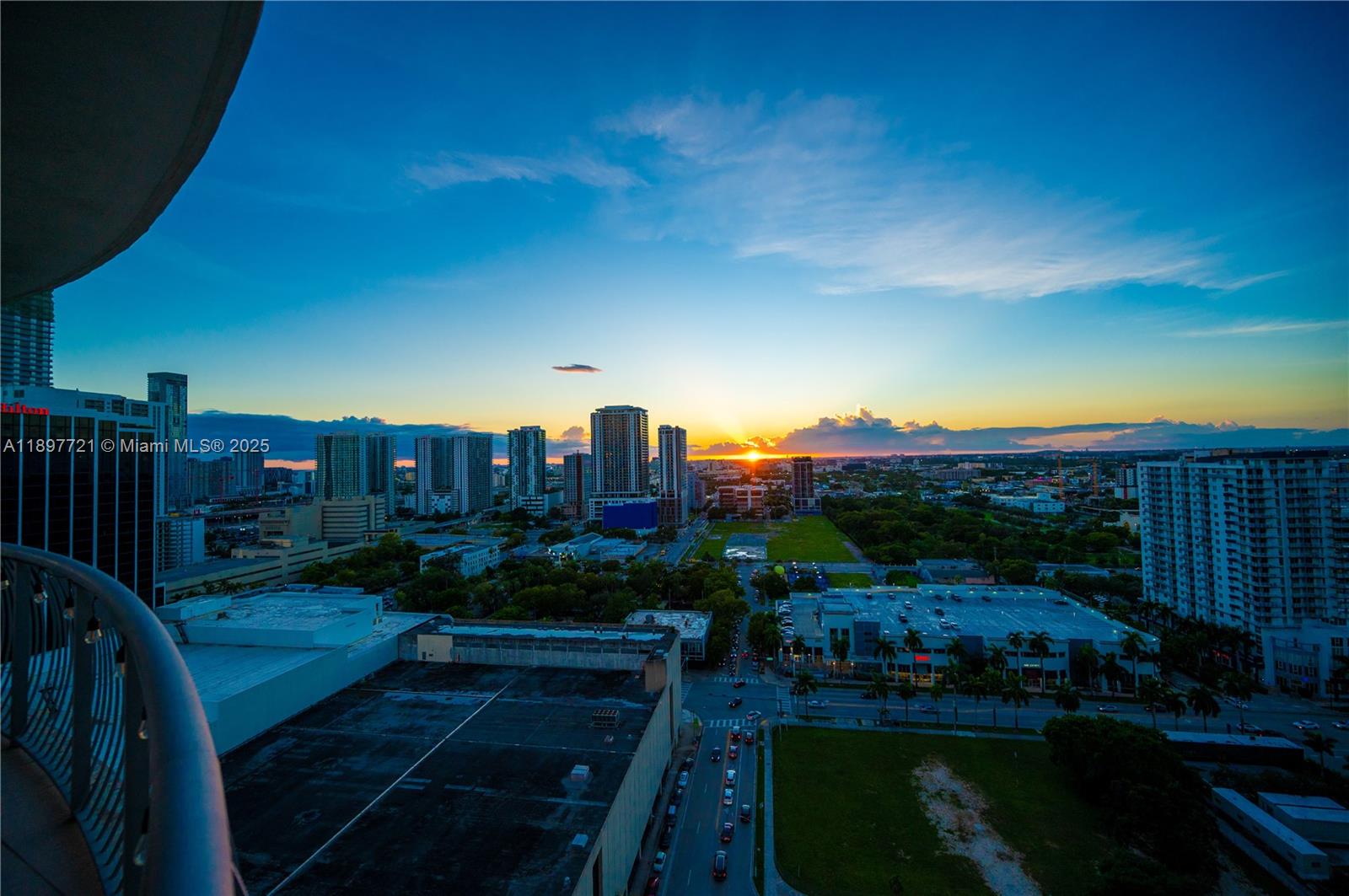 An elevated view of a city skyline at sunset from a balcony — 1750 N Bayshore Dr # 2615, Miami FL 33132, MIAMI, FL