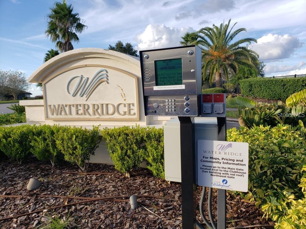 A gated community entrance sign for Water Ridge with an electronic keypad and information plaque — 295 SPINNAKER COURT, AUBURNDALE, FL