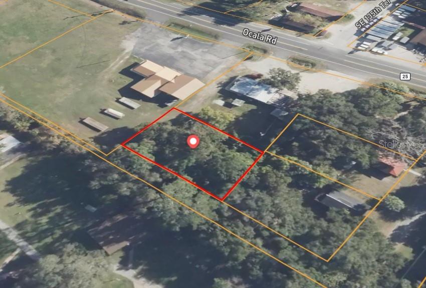This is an aerial map showing a wooded lot outlined in red — 0 SE 122ND PLACE, OCKLAWAHA, FL
