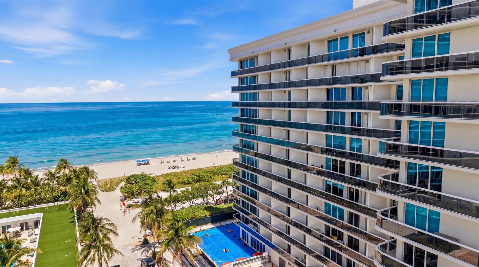 An exterior view of a multi-story beachfront hotel with balconies overlooking the ocean — 9595 Collins Avenue, Surfside FL 33154, SURFSIDE, FL