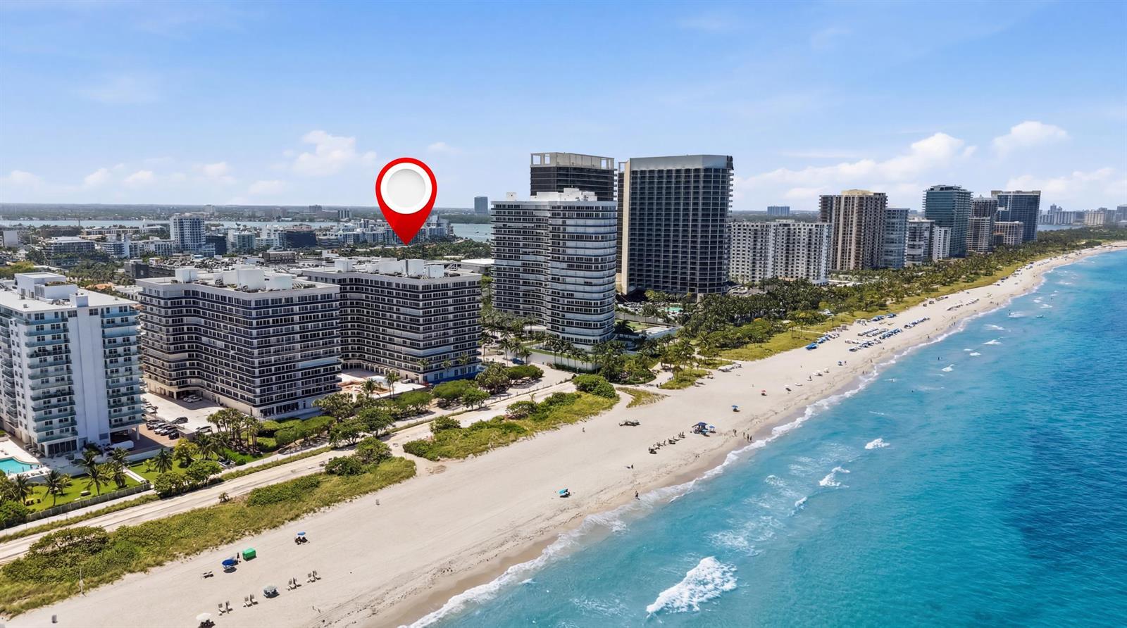 An aerial view of a beachfront condominium complex with a red location pin — 9595 Collins Avenue, Surfside FL 33154, SURFSIDE, FL