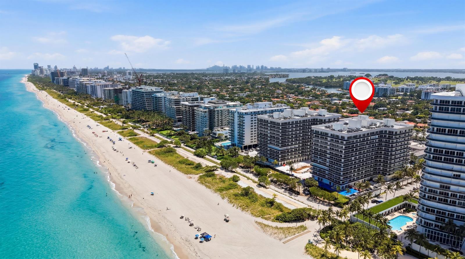Aerial view of a beachfront high-rise apartment complex with a red location pin marker — 9595 Collins Avenue, Surfside FL 33154, SURFSIDE, FL