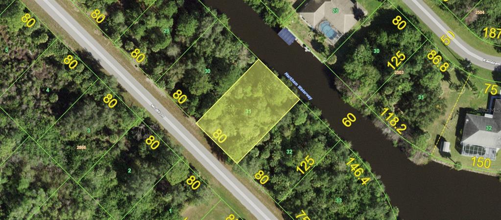 This is a map showing a highlighted vacant lot bordering a waterway and a road — 536 MCDILL DRIVE, PORT CHARLOTTE, FL