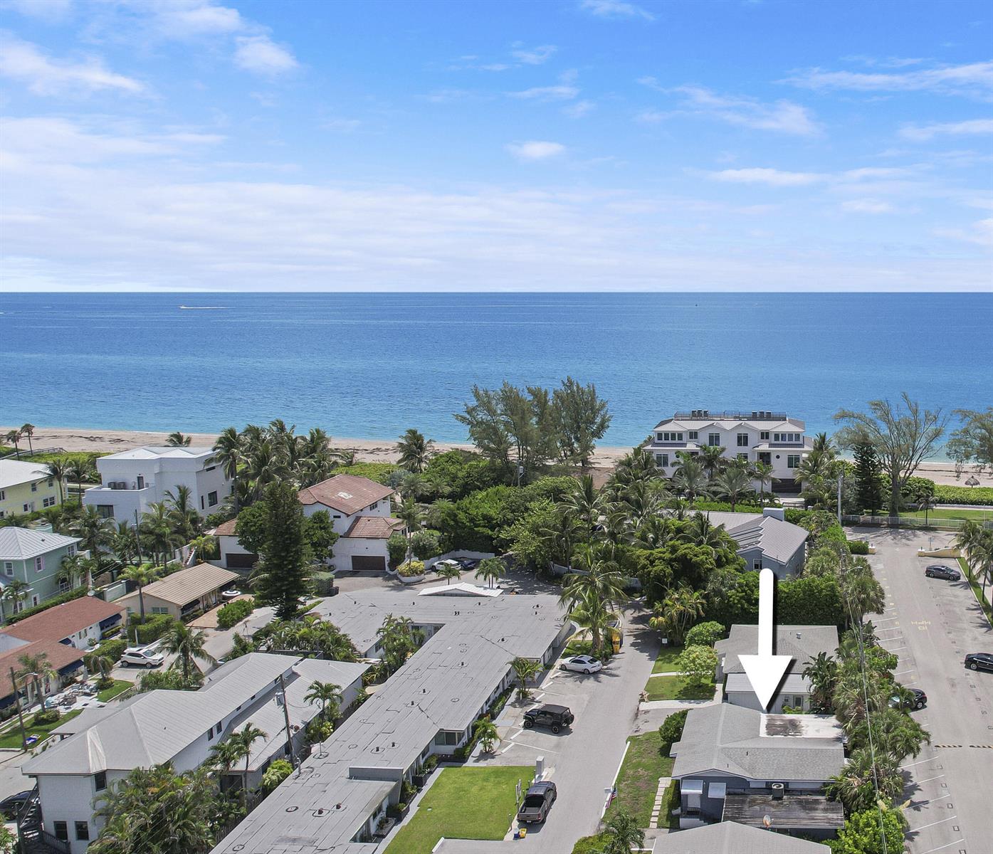 An aerial view shows a coastal neighborhood with a white arrow pointing to a house — 24 Douglas Drive, Ocean Ridge FL 33435, OCEAN RIDGE, FL