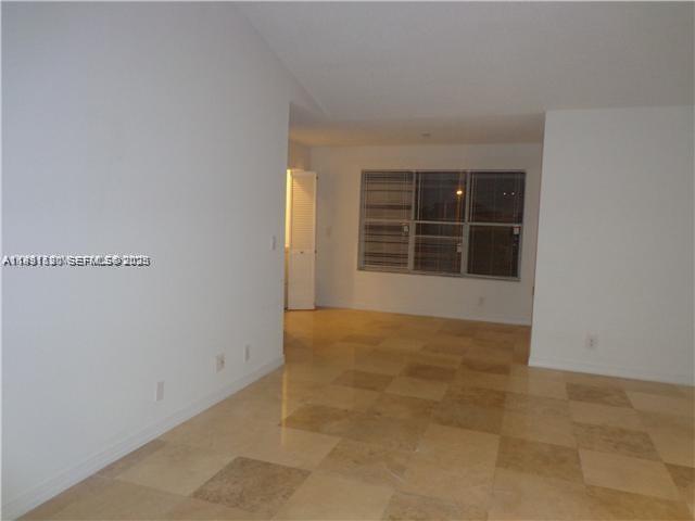 An empty room features white walls, a tiled floor, and a window with blinds — 3300 N Pinewalk Dr N # 1928, Margate FL 33063, MARGATE, FL