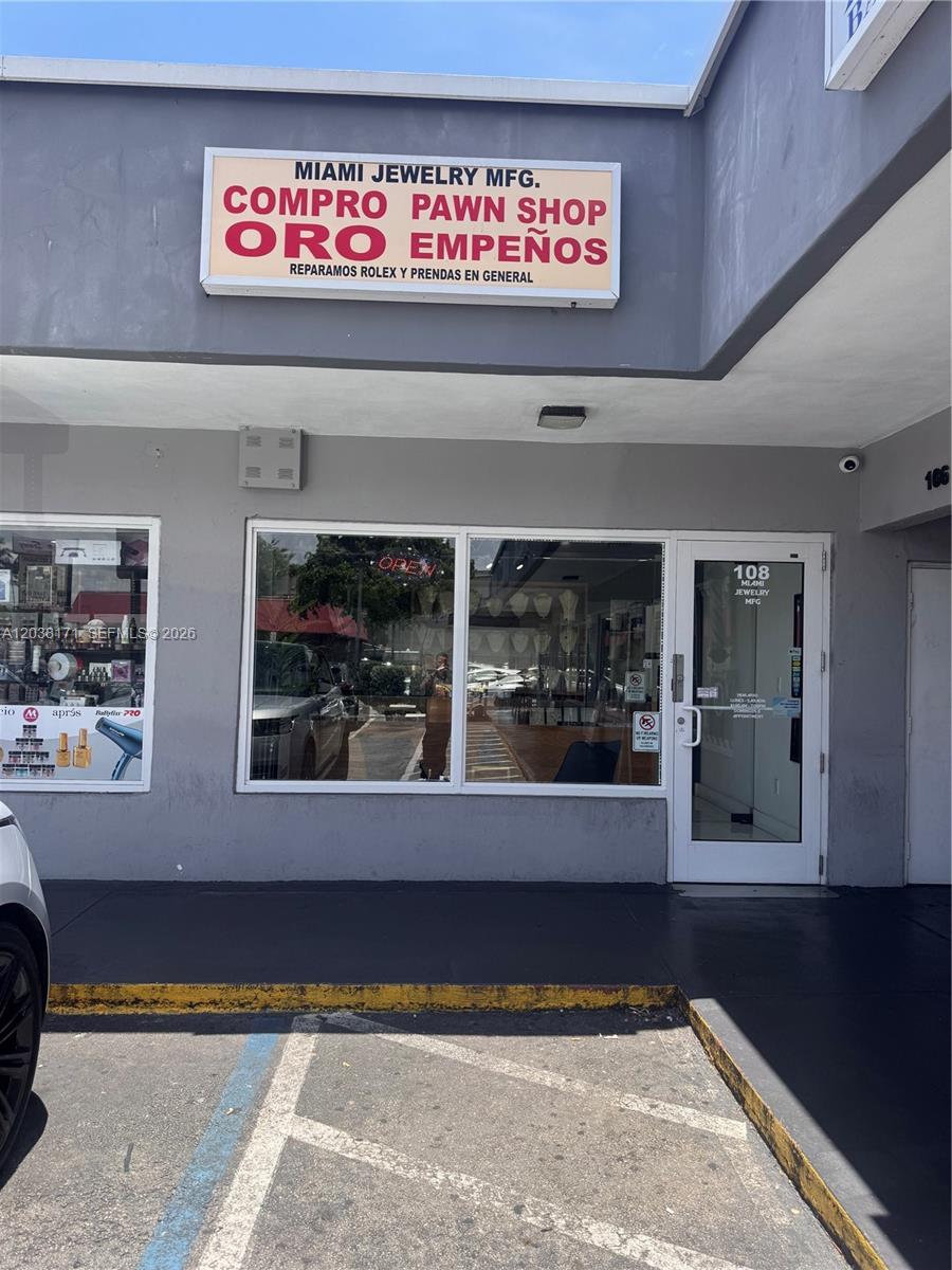 The exterior of a storefront features a sign for a pawn shop and jewelry business — 108 SW 27th ave, Miami FL 33135, MIAMI, FL