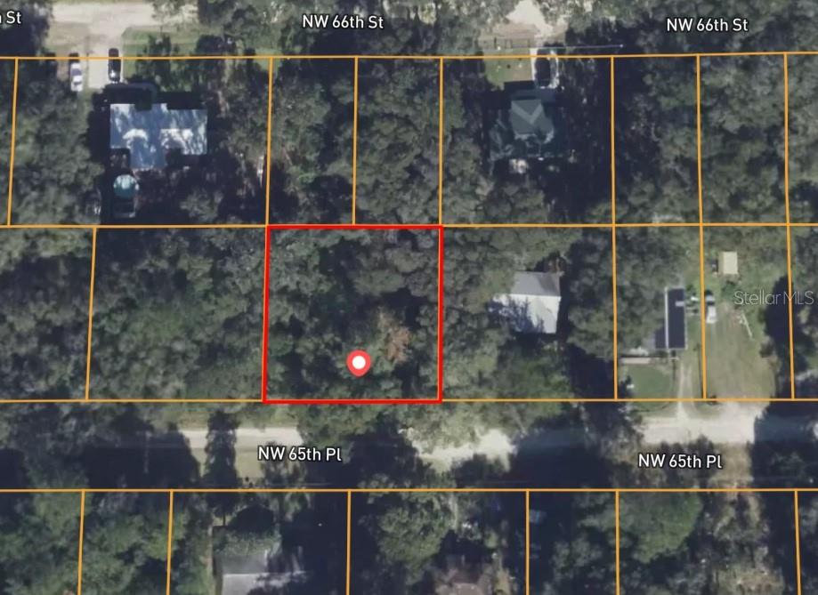 This is an aerial map view of a wooded residential lot outlined in red — 2285 NW 65TH PLACE, OCALA, FL