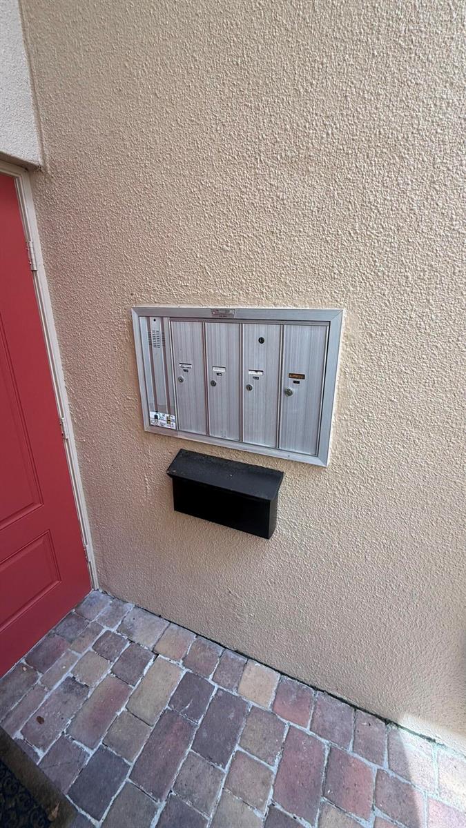 A wall-mounted metal mailbox unit with four compartments and a separate black drop box — 6474 Pumpkin Seed Circle # 206, Boca Raton FL 33433, BOCA RATON, FL