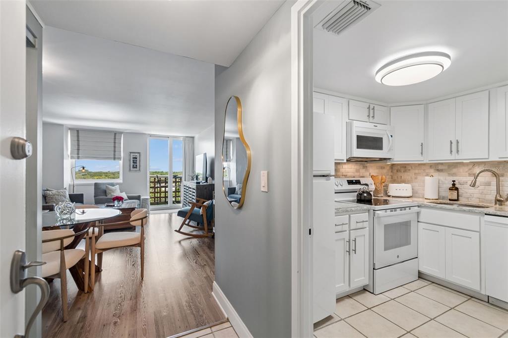 A view from a doorway looking into a living area and a white kitchen — 4015 BAYSHORE BOULEVARD UNIT 7D, TAMPA, FL