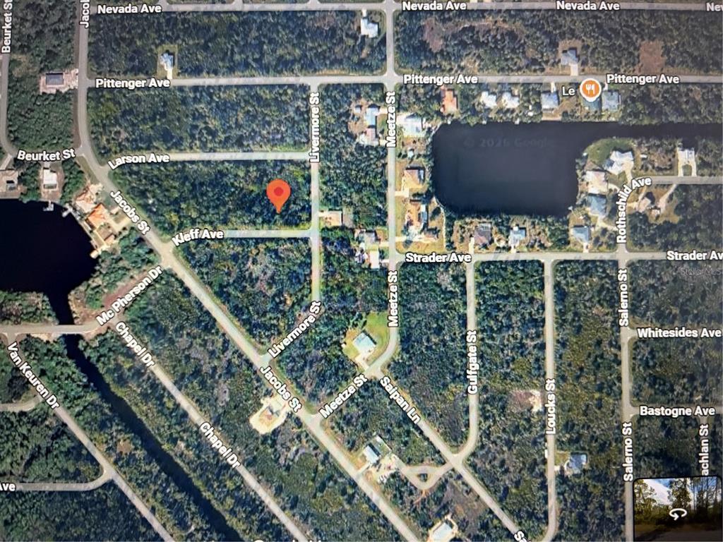 This is an aerial map view of a wooded residential area with marked streets — 14060 KLEFF AVENUE, PORT CHARLOTTE, FL