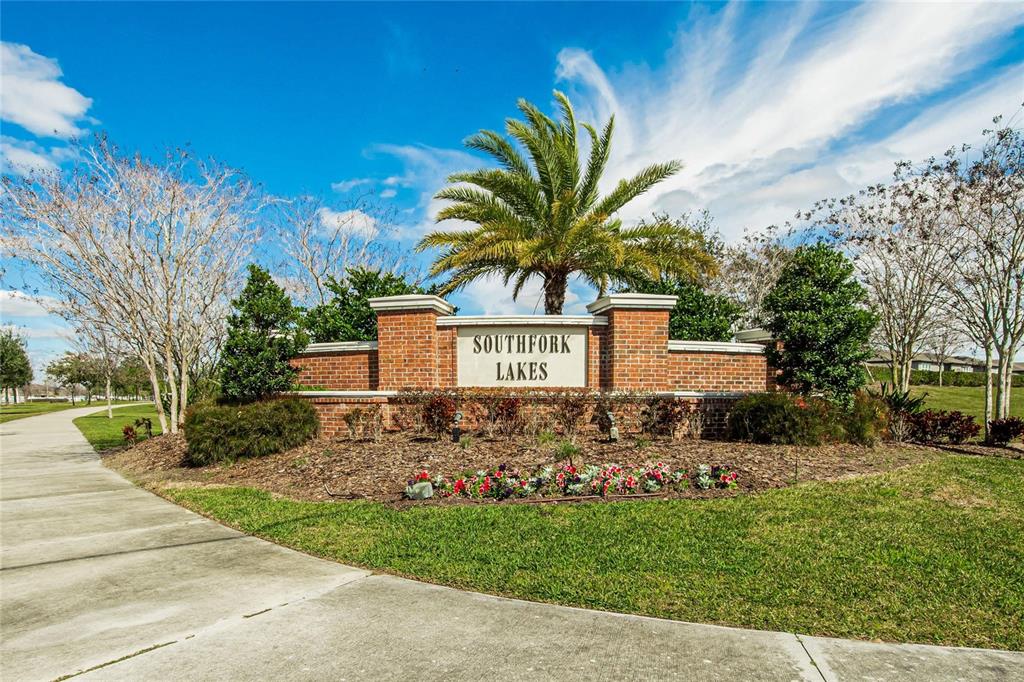 A brick monument sign for Southfork Lakes stands in a landscaped area with a palm tree — 11355 LELAND GROVES DRIVE, RIVERVIEW, FL