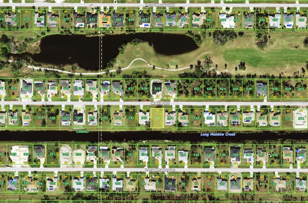 This is an aerial map showing residential lots, streets, a pond, and a canal — 223 MARKER ROAD, ROTONDA WEST, FL