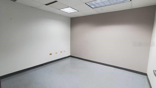 An empty office room features light gray walls, a drop ceiling, and light-colored flooring — 1510 F. D. ROOSEVELT AVE., GUAYNABO, PR