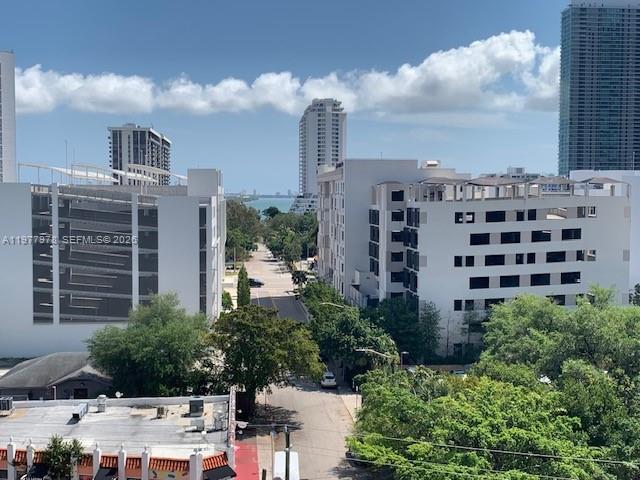 An elevated view shows a street lined with trees between several large apartment buildings — 3470 E Coast Ave # H0708, Miami FL 33137, MIAMI, FL