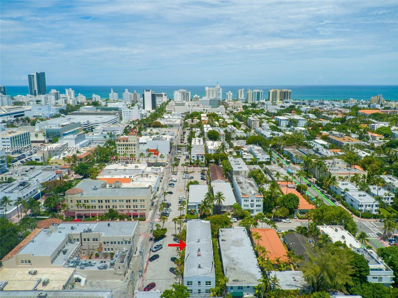 An aerial view shows a city street with a red arrow pointing to a building — 1618 Michigan Ave # 38, Miami Beach FL 33139, MIAMI BEACH, FL