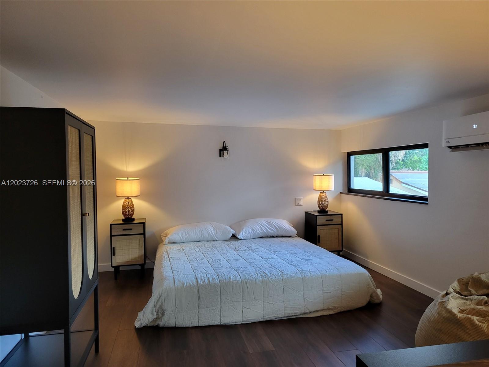 A bedroom features a bed, two nightstands with lamps, a wardrobe, and a window — 5866 SW 60th St # 3, Miami FL 33143, MIAMI, FL