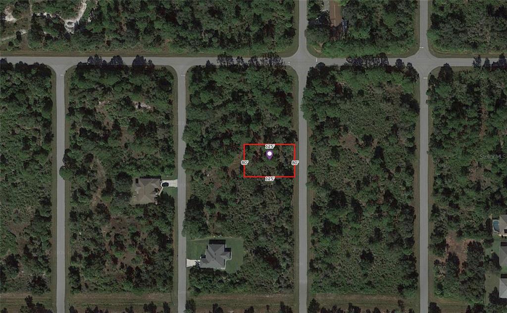 An aerial view of a rectangular vacant lot outlined in red within a residential neighborhood — 263 SPAULDING STREET, PORT CHARLOTTE, FL