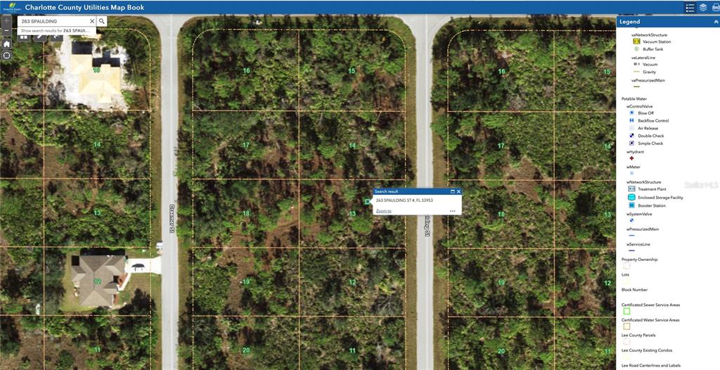 This is a digital map showing undeveloped residential lots and street layouts in Charlotte County — 263 SPAULDING STREET, PORT CHARLOTTE, FL