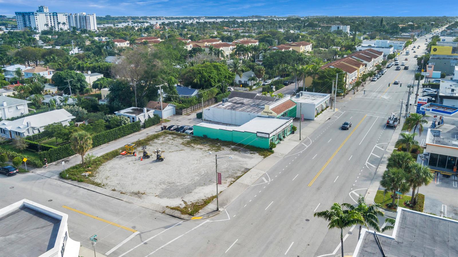 An aerial view shows a vacant corner lot next to a commercial building and road — 3500 S Dixie Highway, West Palm Beach FL 33405, WEST PALM BEACH, FL
