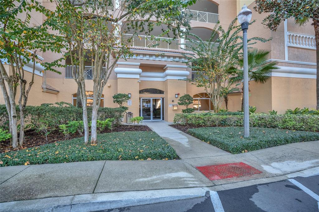 A wooden gazebo with a picnic table sits at the end of a lake pier — 6336 BUFORD STREET UNIT 405, ORLANDO, FL