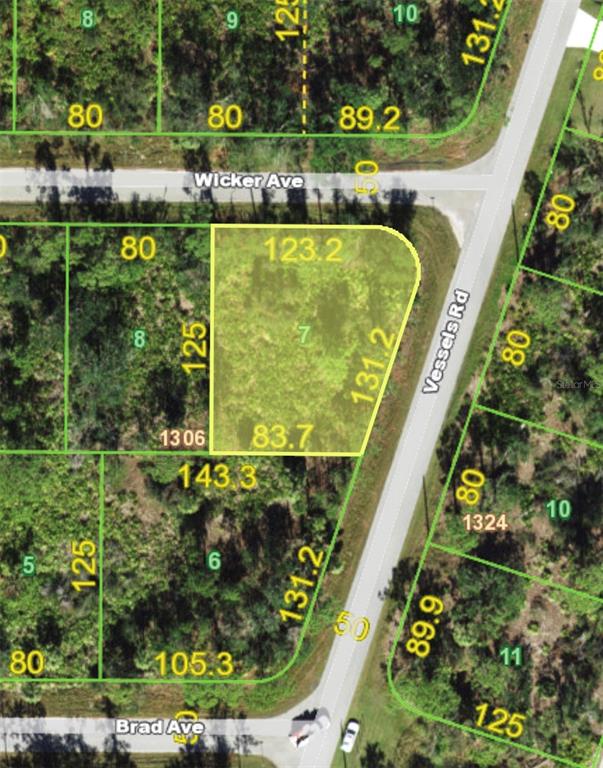 This is a map showing a highlighted vacant lot located at a street intersection — 23333 WICKER AVENUE, PUNTA GORDA, FL