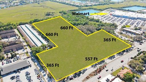 This aerial map shows a vacant, irregularly shaped plot of land outlined in yellow — 1905 S. PARROTT AVE., Okeechobee FL 34974, OKEECHOBEE, FL