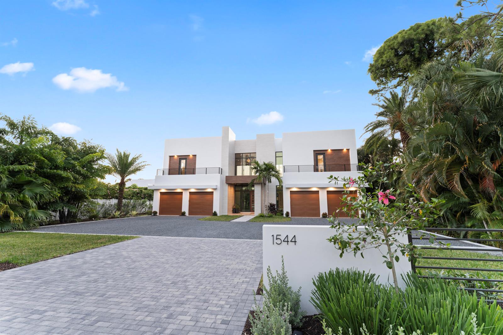 A modern two-story house with a four-car garage and a paved driveway — 1544 SE Saint Lucie Boulevard, Stuart FL 34996, STUART, FL