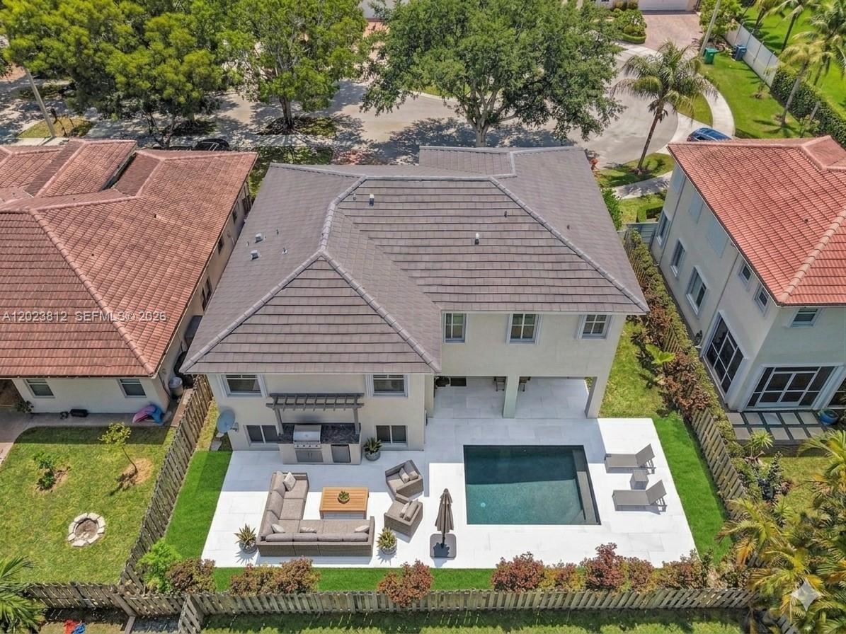 An aerial view shows a two-story house with a backyard pool and patio area — 2864 SW 138th Path, Miami FL 33175, MIAMI, FL