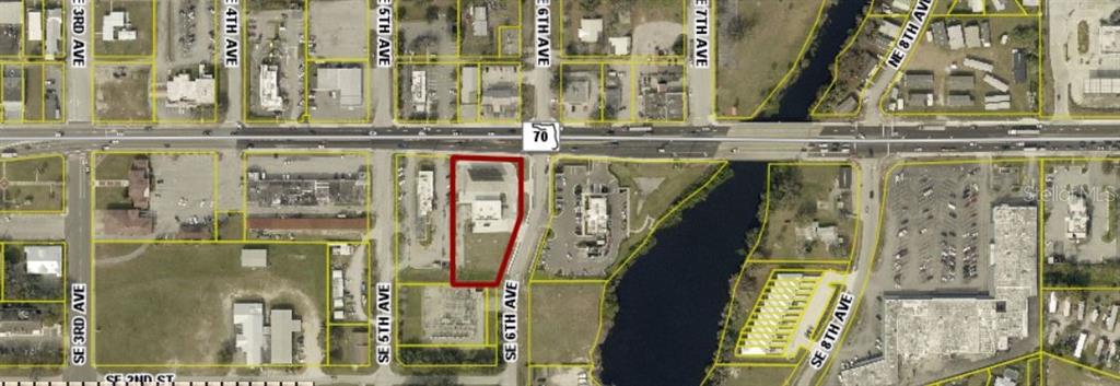 This is an aerial map showing a property outlined in red near a major highway — 510 NE PARK STREET, OKEECHOBEE, FL