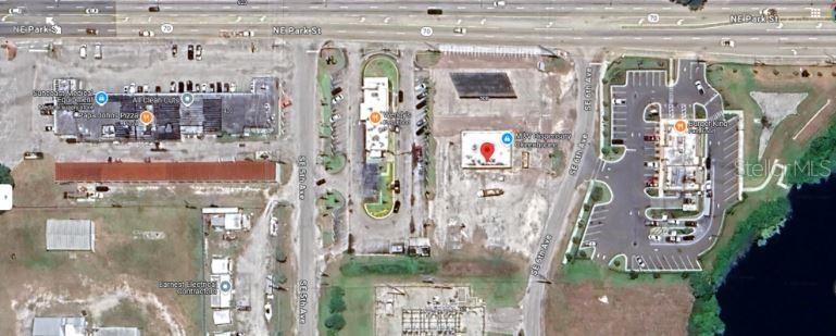 This is an aerial map view of a commercial area with several buildings and parking lots — 510 NE PARK STREET, OKEECHOBEE, FL