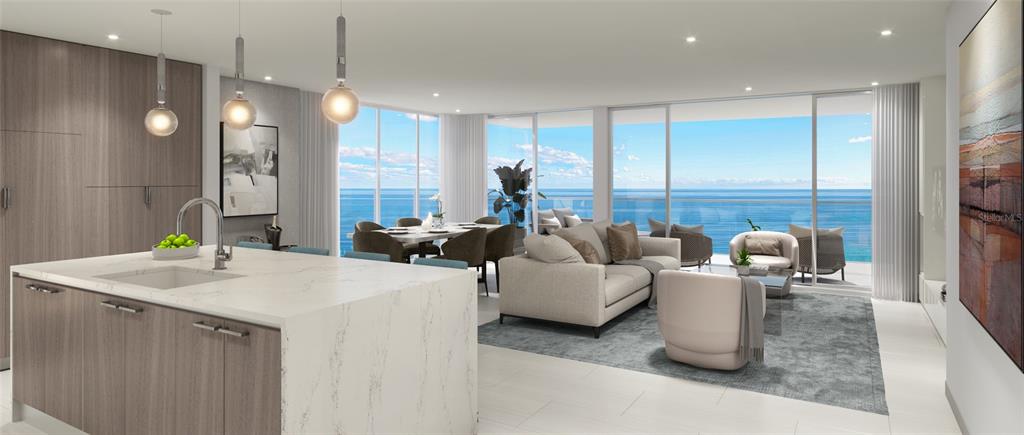 A swimming pool with lounge chairs sits on a patio beside a tall apartment building — 5713 BOWEN DANIEL DRIVE UNIT 604, TAMPA, FL