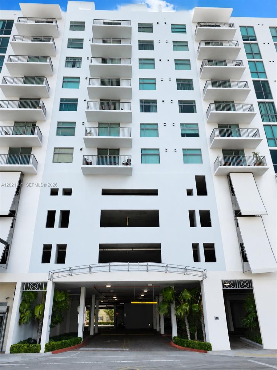 This is a low-angle exterior view of a white multi-story residential building with balconies — 140 S Dixie Hwy # 510, Hollywood FL 33020, HOLLYWOOD, FL