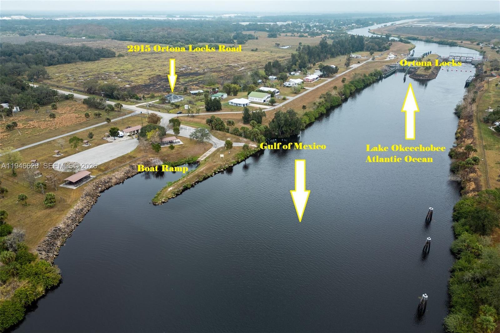 An aerial view shows a river, a boat ramp, and the Ortona Locks — 2915 Ortona Locks Rd, Moore Haven FL 33471, MOORE HAVEN, FL