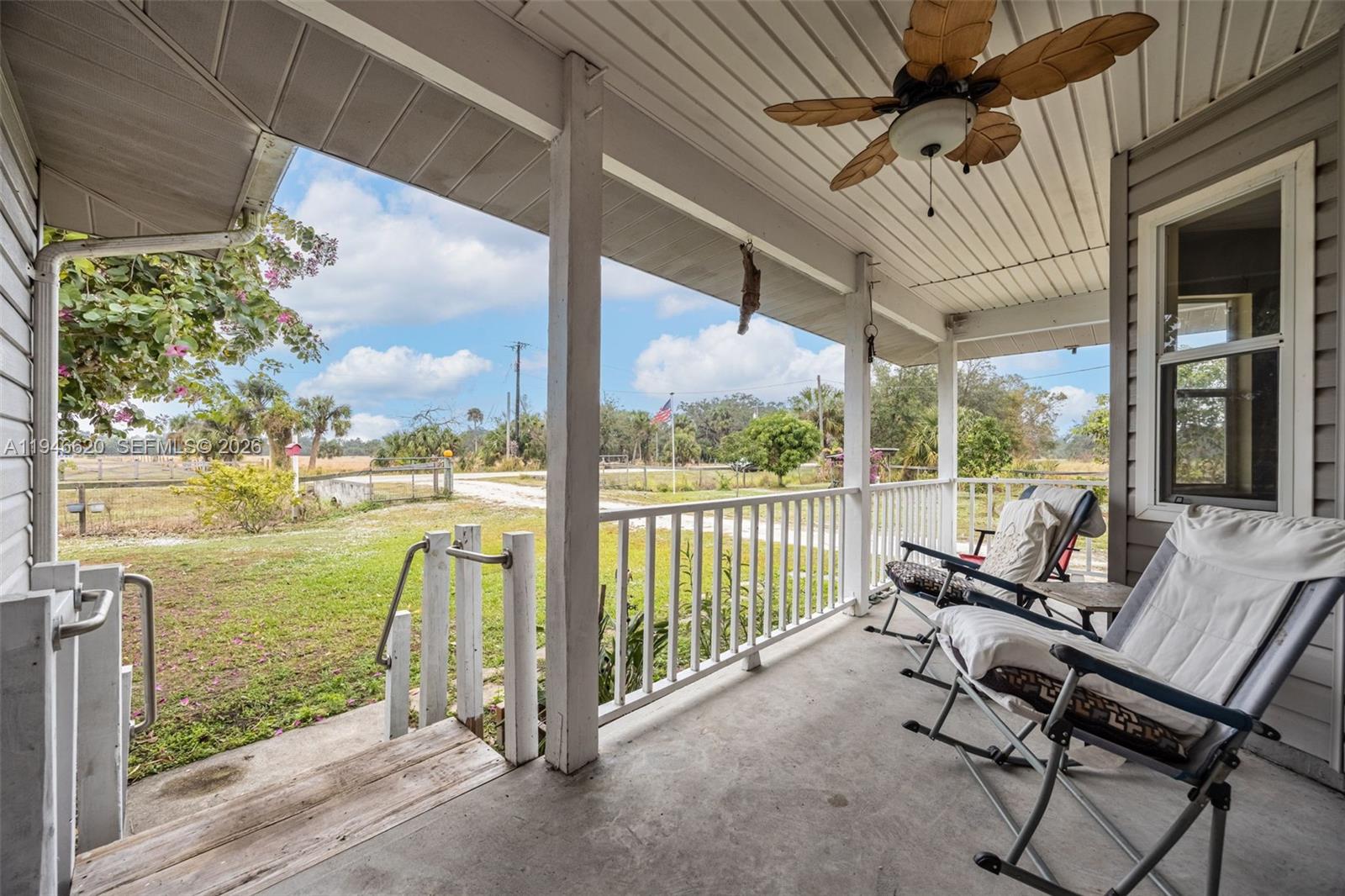 An aerial view shows a waterfront park with a parking lot, picnic shelters, and a camper — 2915 Ortona Locks Rd, Moore Haven FL 33471, MOORE HAVEN, FL