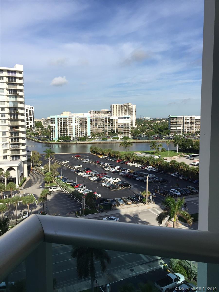 An elevated view shows a parking lot, a waterway, and several high-rise apartment buildings — 3801 S Ocean Dr # 10V, Hollywood FL 33019, HOLLYWOOD, FL