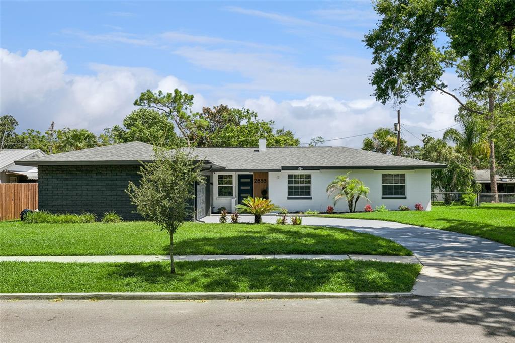 A single-story house with a white and dark gray brick exterior and a gray roof — 2833 PRINCE JOHN ROAD, WINTER PARK, FL