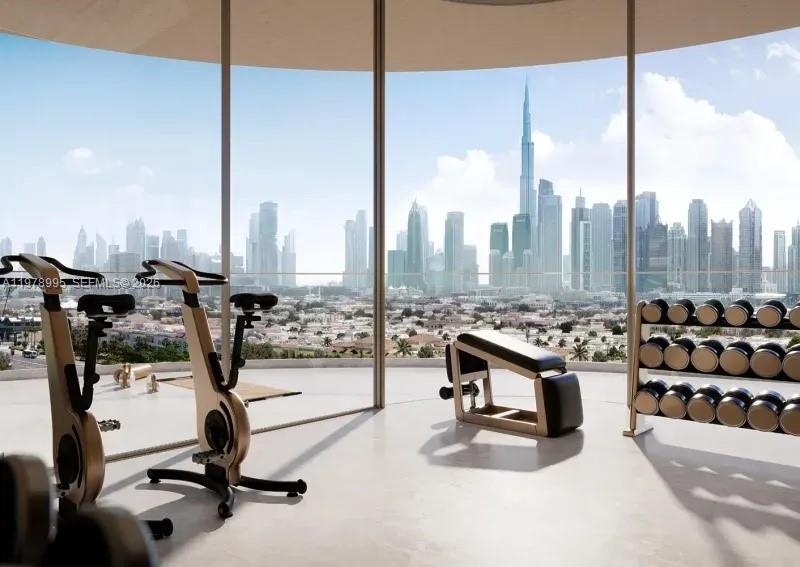This rendering shows a gym with exercise equipment and floor-to-ceiling windows overlooking a city skyline — 65 24C Street # 0, Dubai, FL