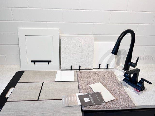 A display of interior design samples including cabinetry, countertops, flooring, carpet, and plumbing fixtures — 14522 BANKS COURT, PARRISH, FL