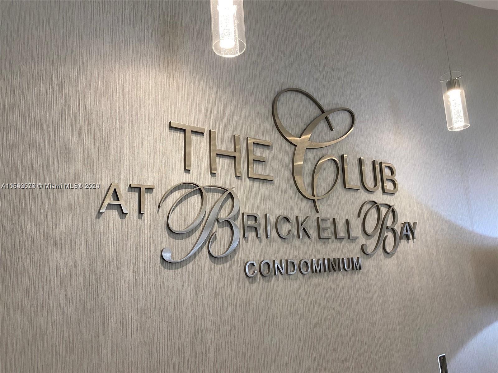 A wall sign displays the name The Club at Brickell Bay Condominium in metal lettering — 1200 Brickell Bay Dr # 3119, Miami FL 33131, MIAMI, FL