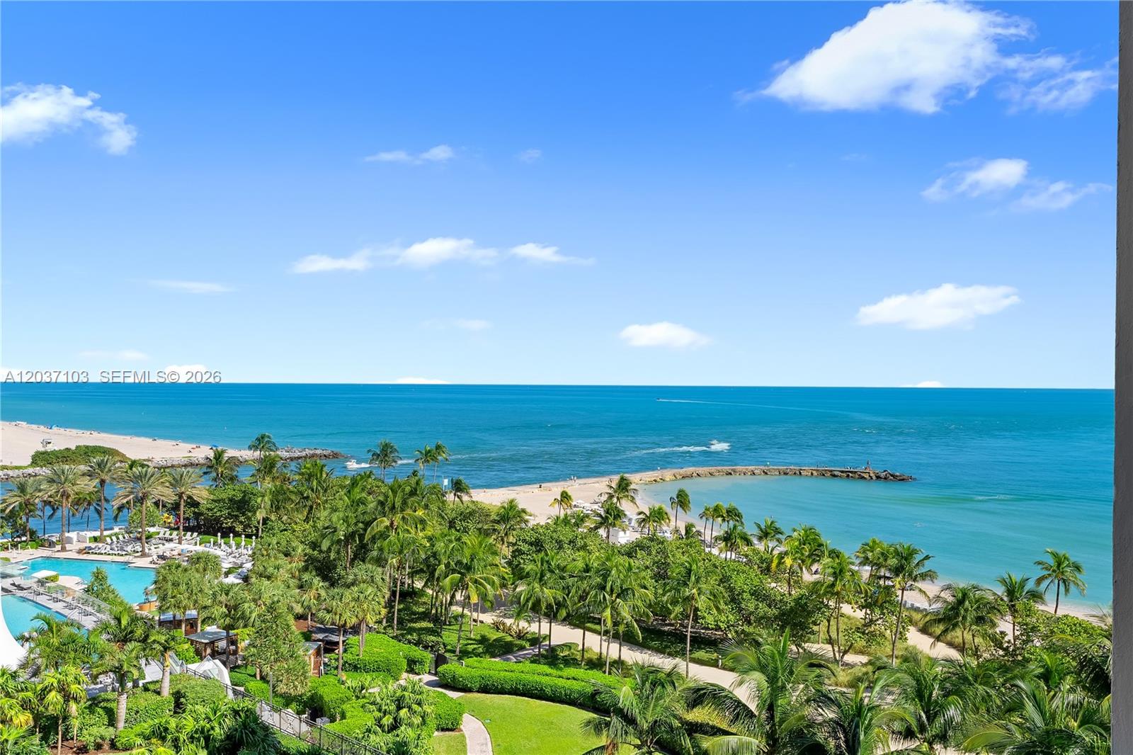 An elevated view shows a tropical beach, a swimming pool, and the ocean — 10275 Collins Ave # 807, Bal Harbour FL 33154, BAL HARBOUR, FL
