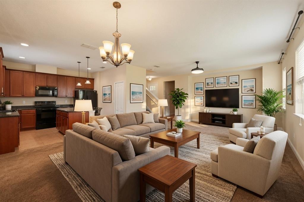 A living room with a sectional sofa, two armchairs, and an open kitchen with cabinets — 1532 NATURE TRAIL, KISSIMMEE, FL