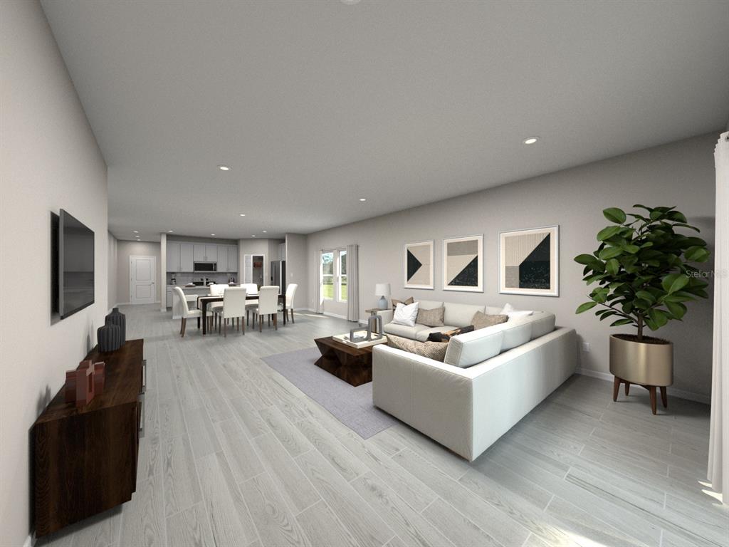This is a digital rendering of an open-concept living room and kitchen with light flooring — 108 GENTLE RAIN LANE, NOKOMIS, FL
